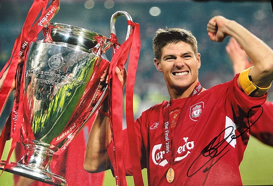 Signed photograph of Steven Gerrard holding the Champions League trophy